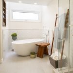 Modern Coastal interior designer Redondo Beach CA bright and airy white master bathroom with freestanding tub and frameless glass shower