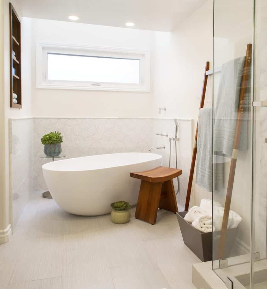 Modern Coastal interior designer Redondo Beach CA bright and airy white master bathroom with freestanding tub and frameless glass shower