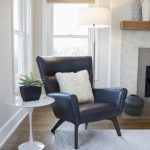 Interior designer Redondo Beach CA bright airy living room side chair with marble tulip side table and windows beyond. Manhattan Beach modern coastal home