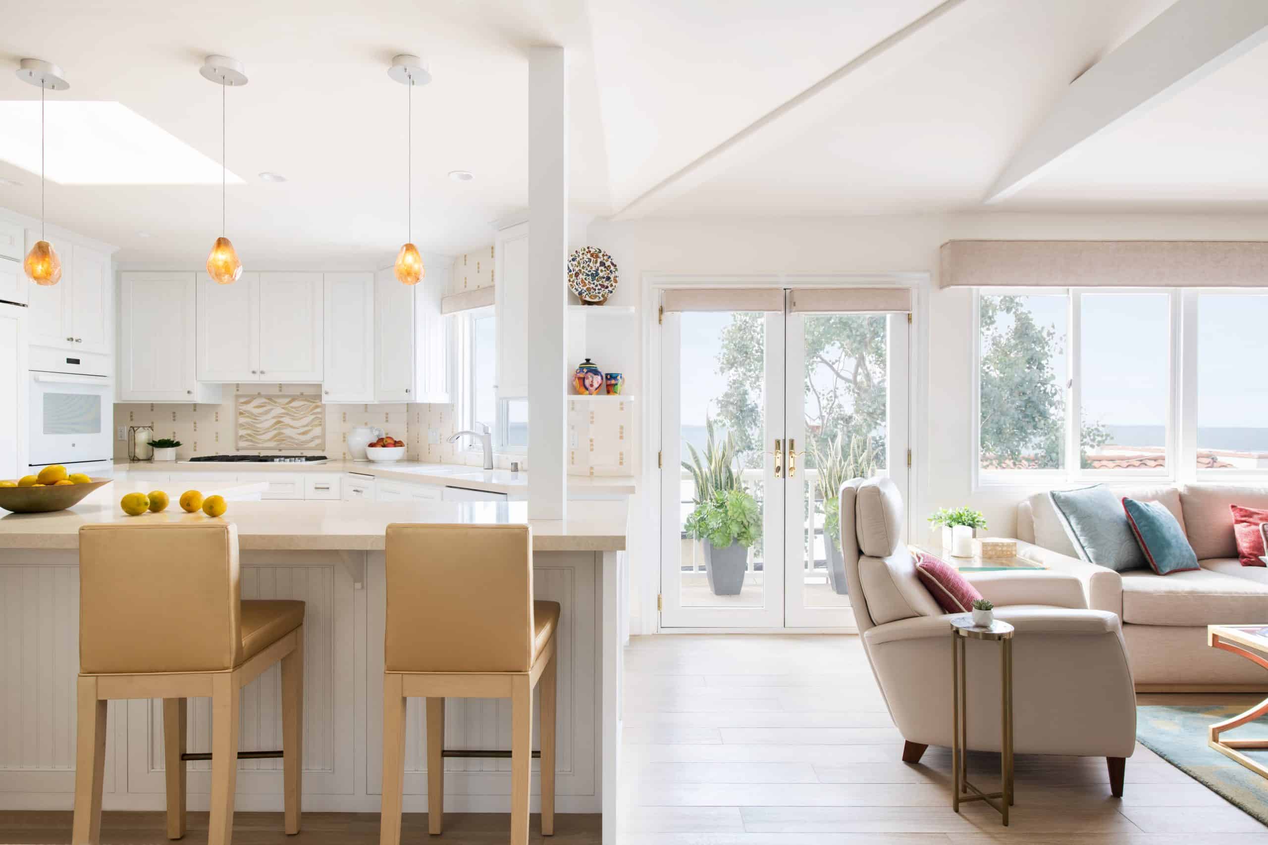 Beachy contemporary Manhattan Beach home with open concept warm neutral kitchen and living room