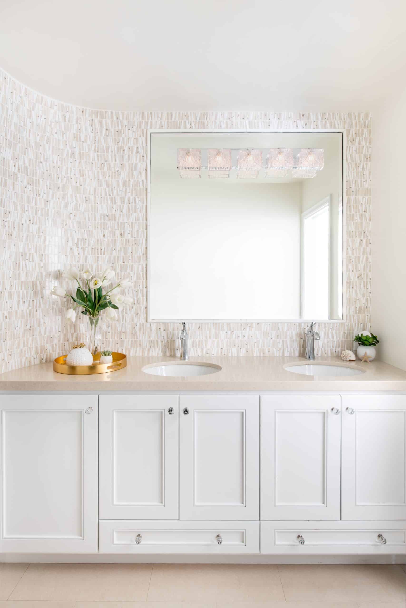 Bright and beachy master bathroom vanity with white counter-top and vanity cabinet in Manhattan Beach
